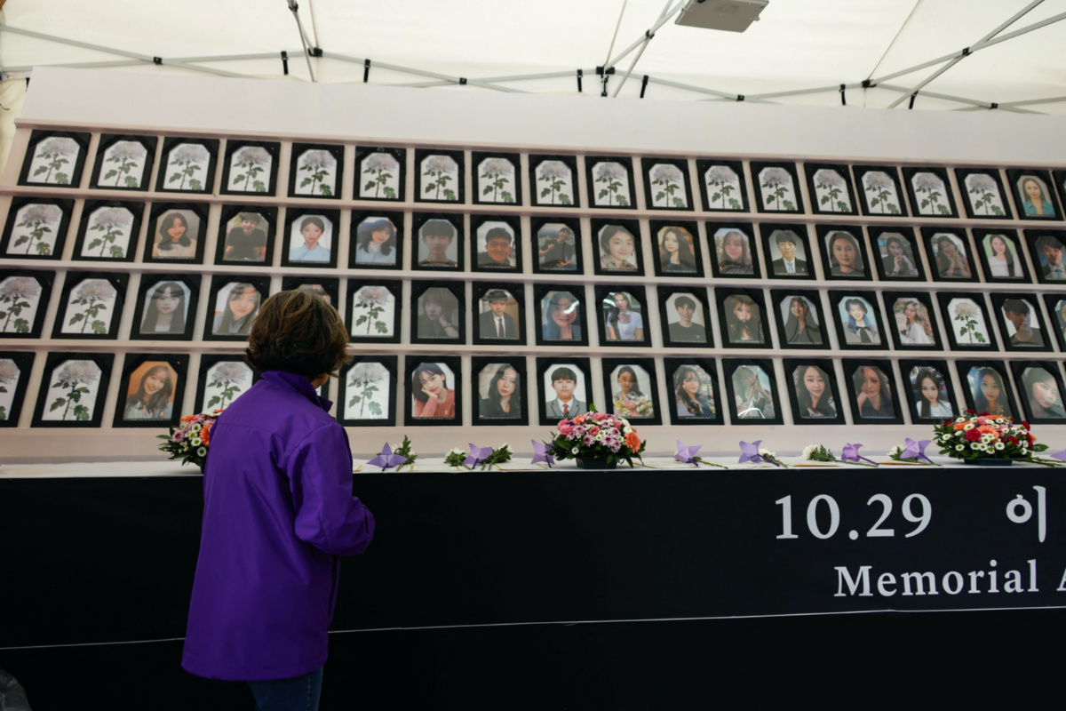 Kim Young-nam, whose daughter died in the Halloween crowd crush a year ago, looks on portraits of victims of the stampede at a group memorial, at Seoul City Hall Plaza in Seoul, South Korea, on 24th October, 2023. 