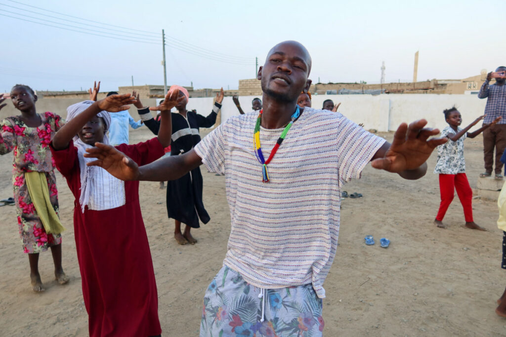 General Kidi, a member of the Nuba Mountain Sound band, trains children to dance, in Port Sudan, in Sudan, on 26th September, 2023