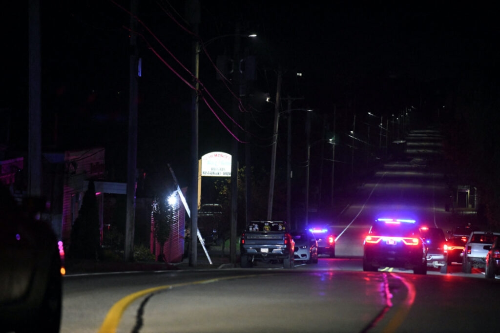 Police close Lincoln Street leading to Schemengees Bar & Grille Restaurant after deadly mass shootings in Lewiston, Maine, US, on 26th October, 2023