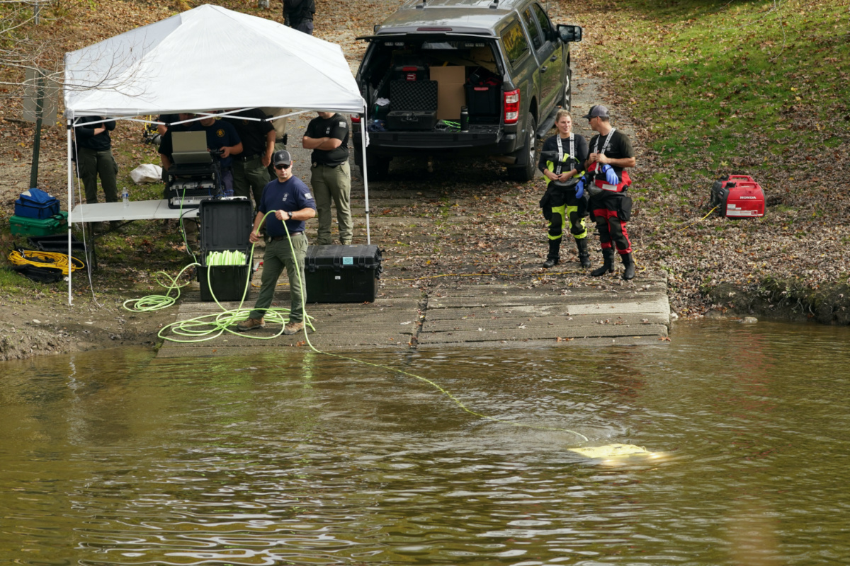 Members of law enforcement search a river in Lisbon Falls, Maine, US, on 27th October, 2023. 