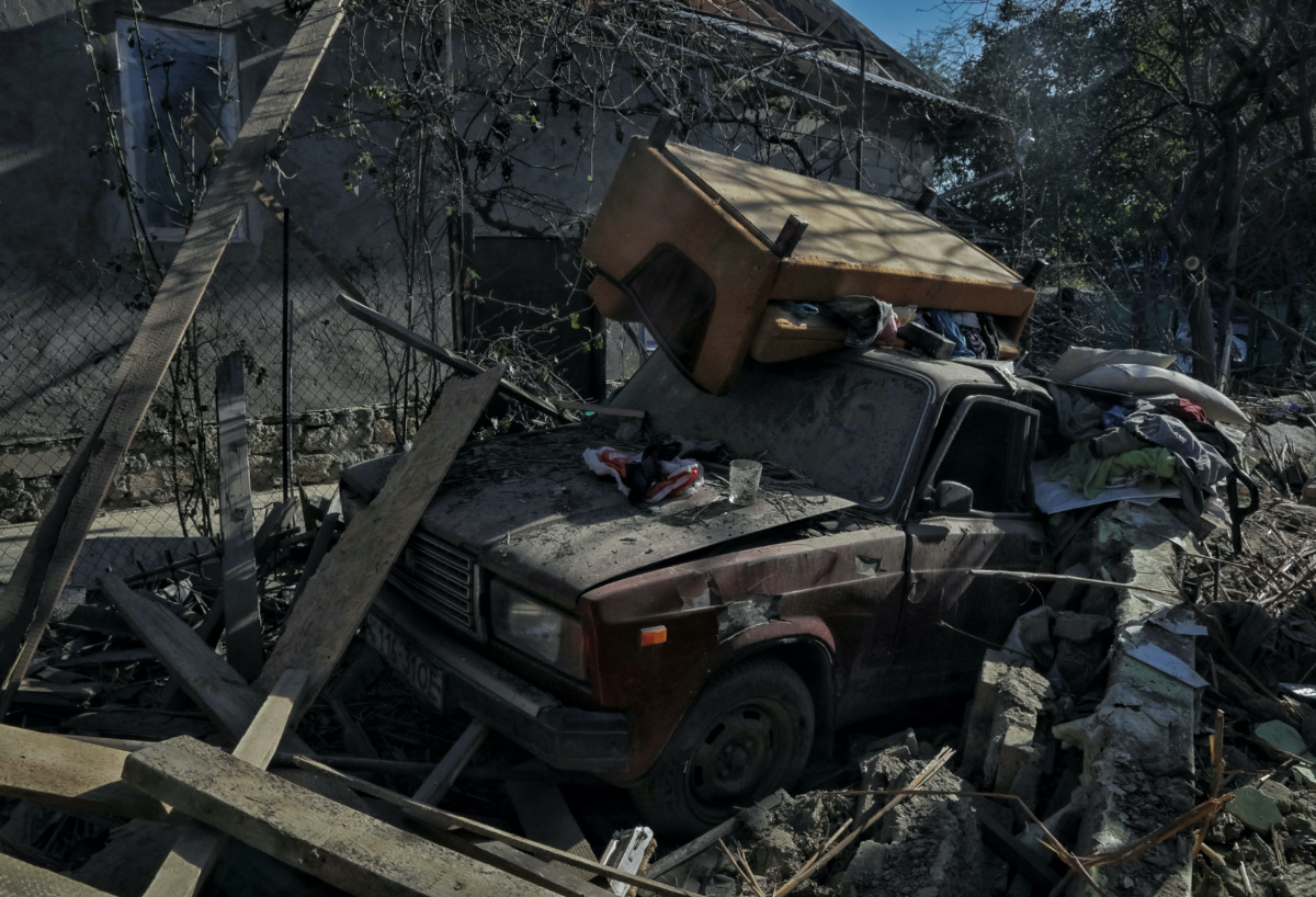 A destroyed car is seen outside a house damaged by a Russian drone strike, amid Russia's attack on Ukraine, in Izmail, Odesa region, Ukraine, on 12th October, 2023