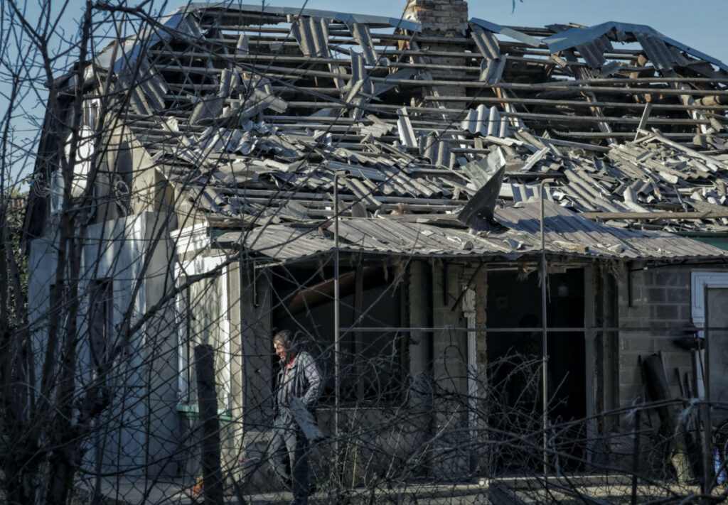 A local resident is seen outside a house damaged by a Russian drone strike, amid Russia's attack on Ukraine, in Izmail, Odesa region, Ukraine, on 12th October, 2023