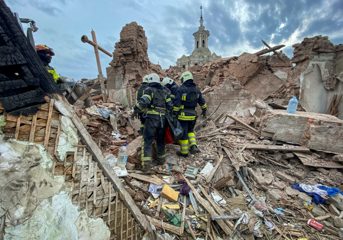 Rescues carry a bag with the body of 10-year-old boy Tymofii released from debris at a site of a residential building damaged by a Russian missile strike, amid Russia's attack on Ukraine, in Kharkiv, Ukraine, on 6th October, 2023