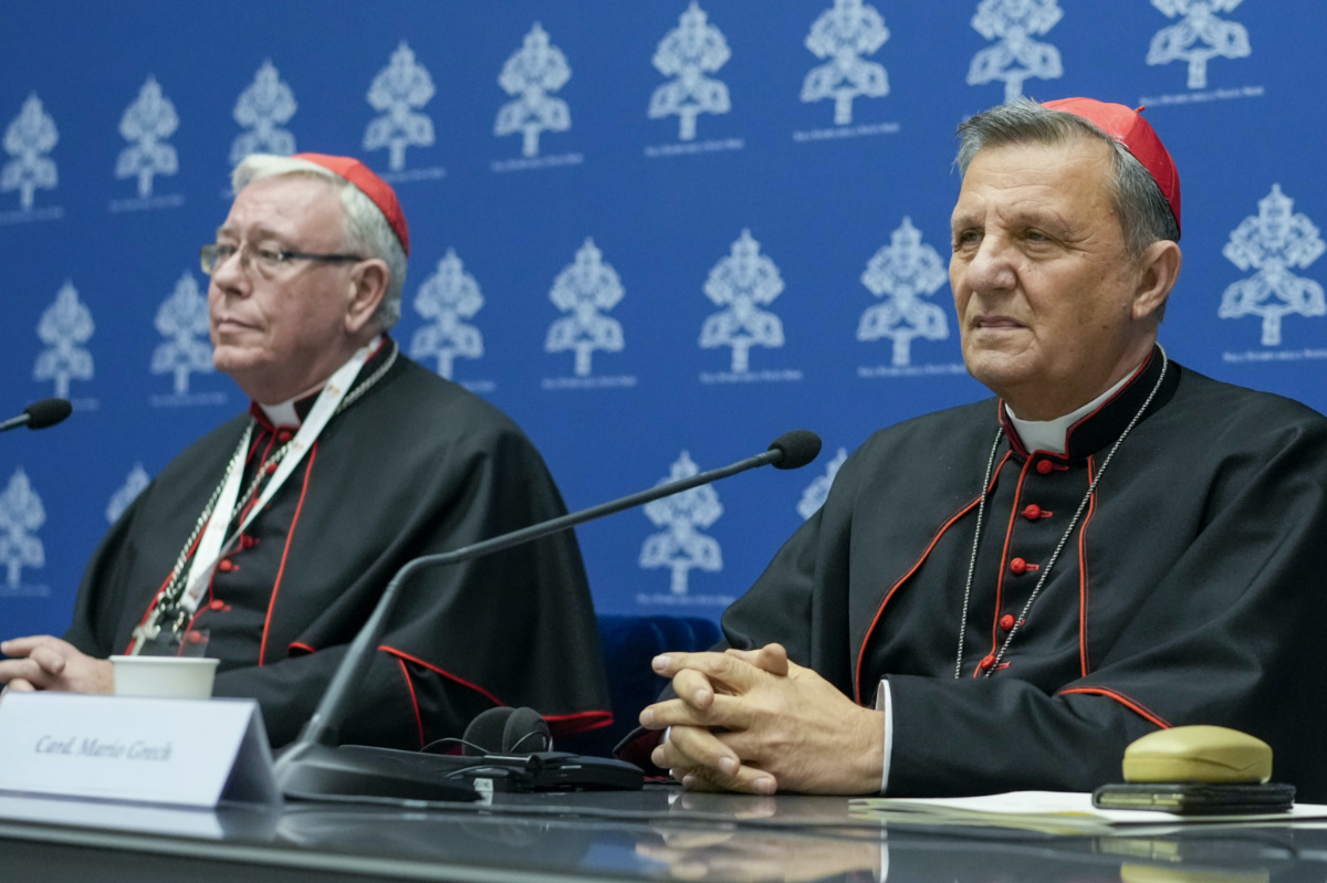 Cardinals Mario Grech, right, and Jean-Claude Hollerich talk to reporters during a press conference for the closing of the 16th general assembly of the synod of bishops, at the Vatican's press room in Rome, Saturday, 28th October, 2023.