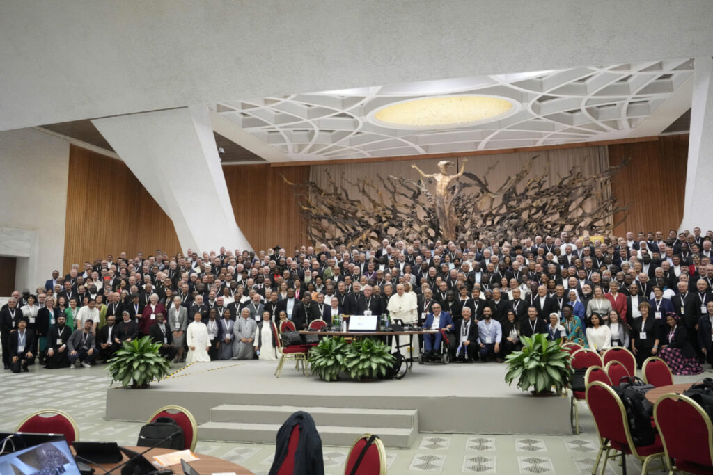 Pope Francis poses for a family picture with the participants of the Synod of Bishops' 16th General Assembly in the Paul VI hall at the Vatican on Monday, 23rd October, 2023