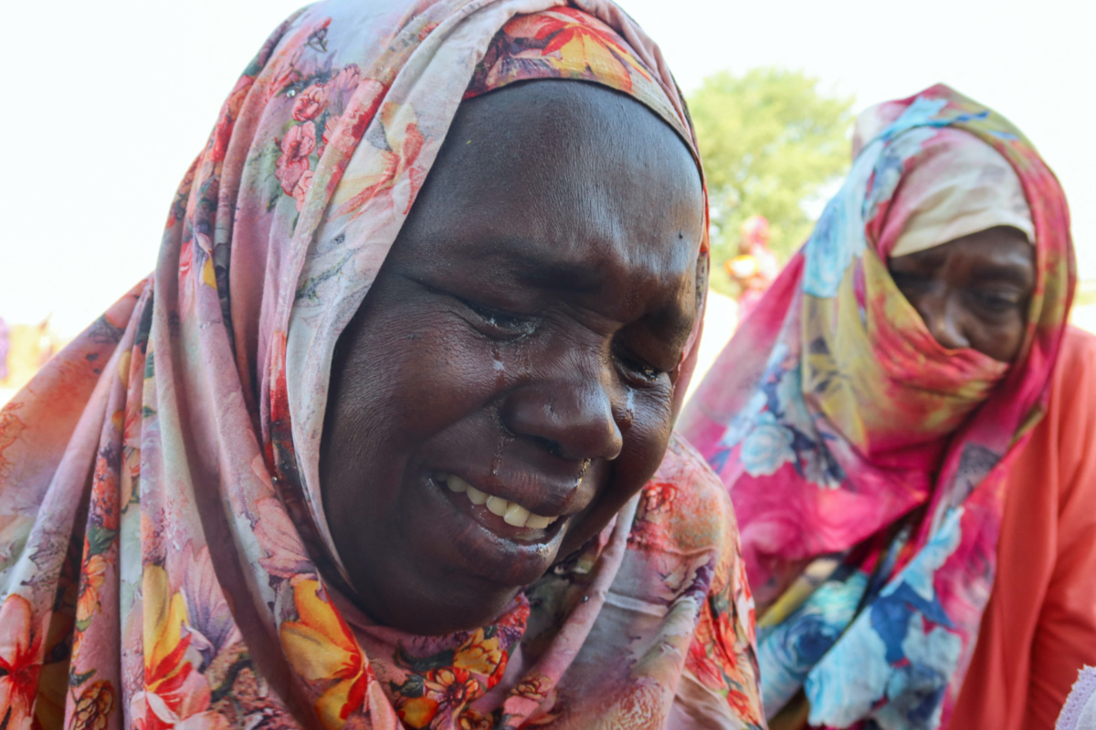 Women from the city of Al-Junina in West Darfur cry after receiving the news about the death of their relatives as they waited for them in Chad, on 7th November, 2023. 