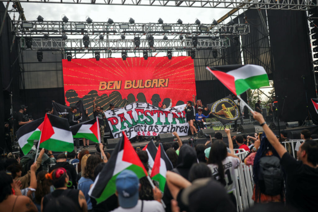 Pro-Palestinian activists attend a charity concert to fund hospitals in Gaza and West Bank, in Santiago, Chile on 25th October, 2023