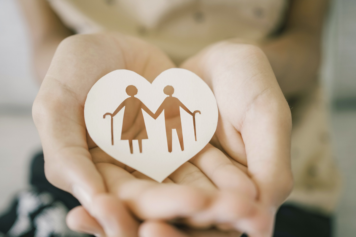 Teen hands holding elderly couple with walking sticks in heart shape, older people mental health, age care concept