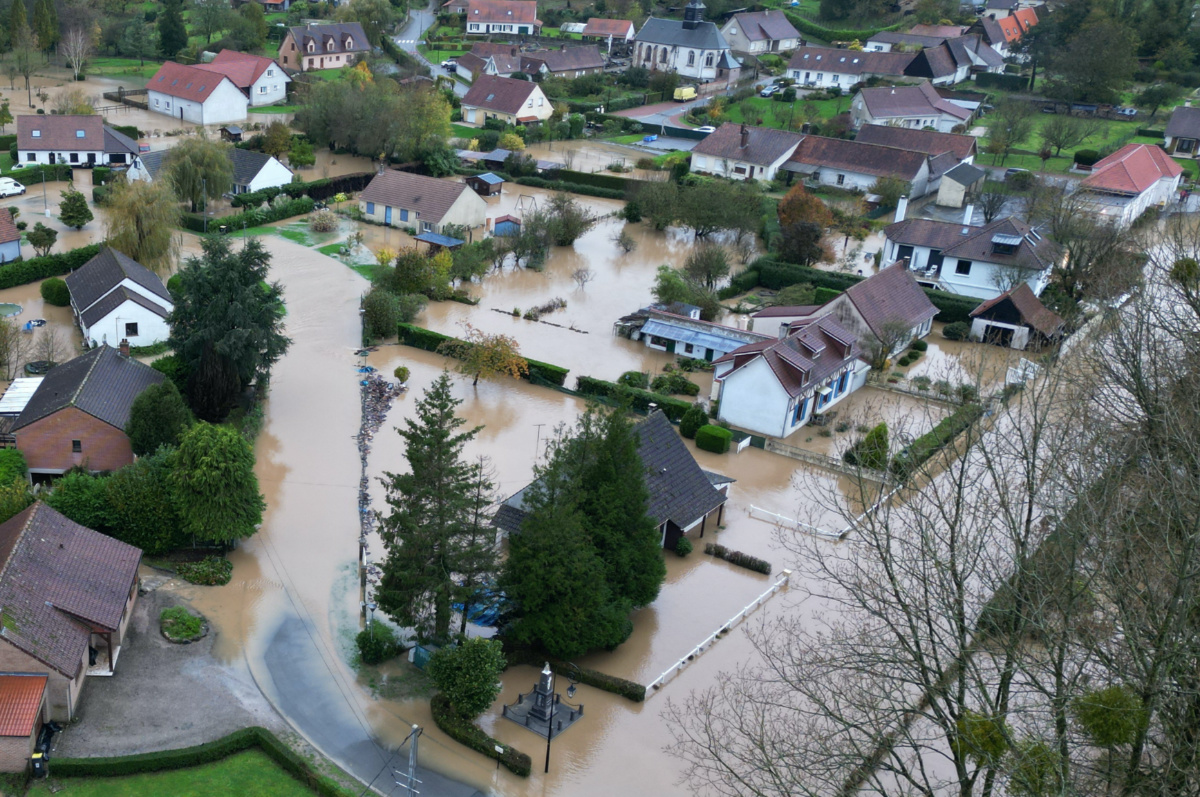 An aerial view shows a flooded area in Estree as the Canche River overflows near Montreuil-sur-Mer after days of heavy rain causing flooding in northern France, on 10th November, 2023. 