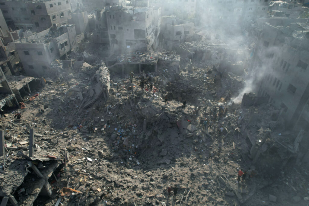 Palestinians gather at the site of Israeli strikes on houses in Bureij in the central Gaza Strip, on 2nd Novembe, 2023.