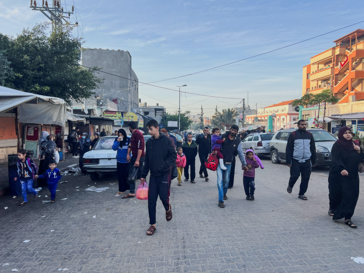 Palestinians walk on a street during a temporary truce between Hamas and Israel, in Khan Younis in the southern Gaza Strip, on 24th November, 2023