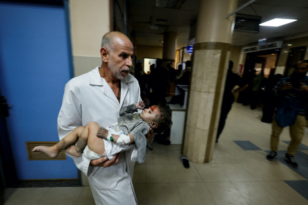 A Palestinian child wounded in an Israeli strike is assisted at Nasser hospital, amid the ongoing conflict between Israel and Palestinian Islamist group Hamas, in Khan Younis in the southern Gaza Strip on 18th November, 2023