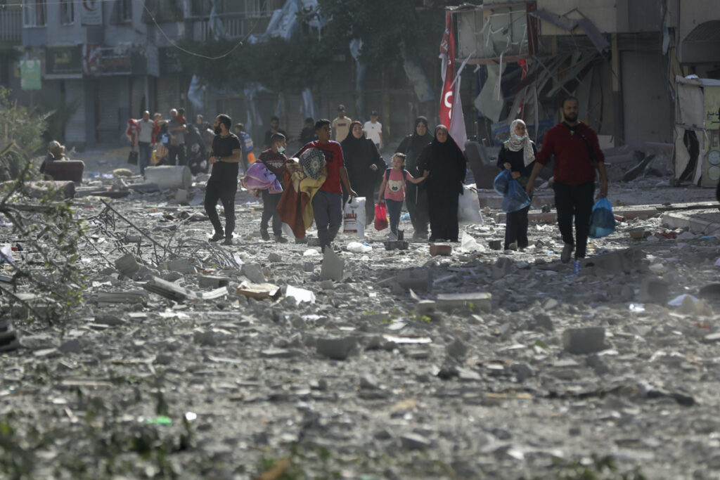 Palestinians leave their homes following Israeli bombardment on Gaza City, Monday, on 30th October, 2023.