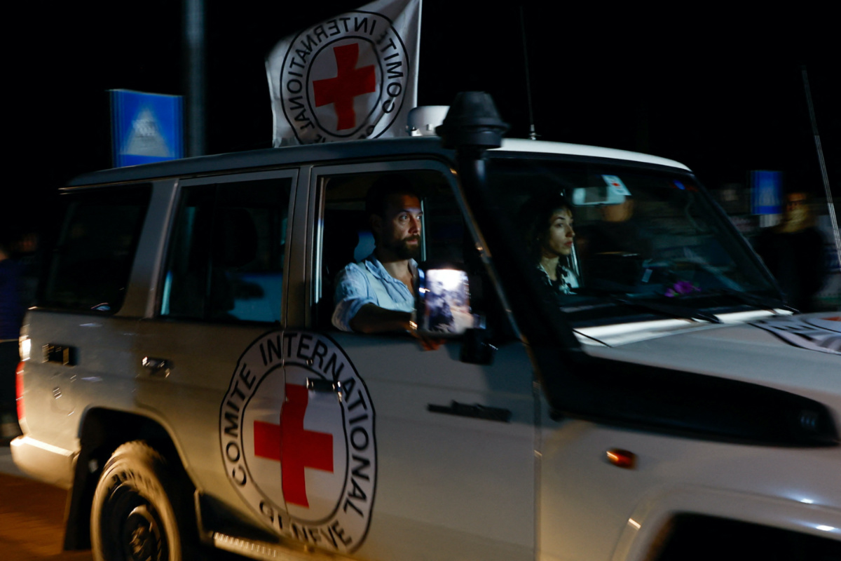 A Red Cross vehicle, as part of a convoy carrying hostages abducted by Hamas militants during the on 7th October attack on Israel, arrives at the Rafah border, amid a hostages-prisoners swap deal between Hamas and Israel, in the southern Gaza Strip, on 29th November, 2023