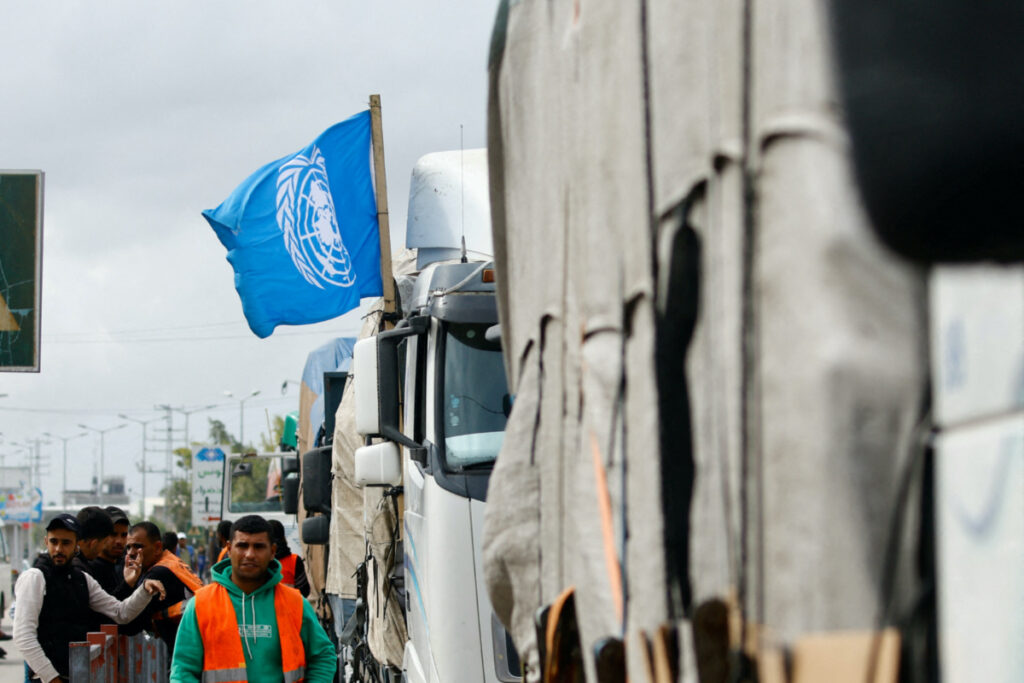 A flag of the United Nations is attached to one of the trucks carrying aid waiting to head towards north Gaza during a temporary truce between Hamas and Israel, in the central Gaza Strip, on 27th November, 2023.