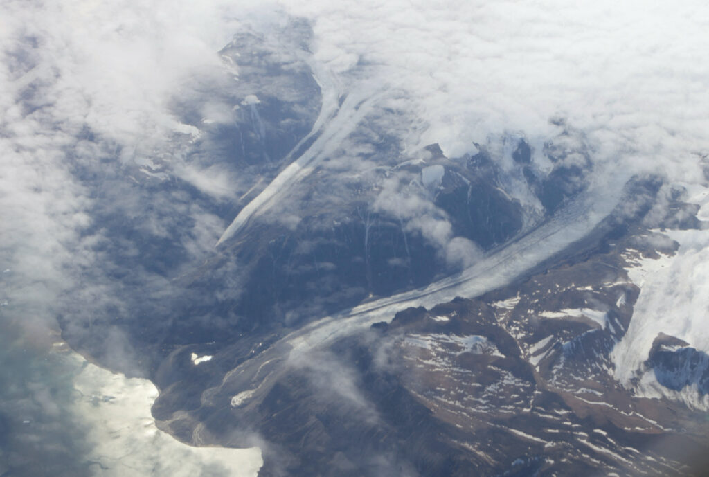 Valleys cut by glaciers of the Greenland Ice Sheet along the mountains of Greenland, on 3rd August, 2022.
