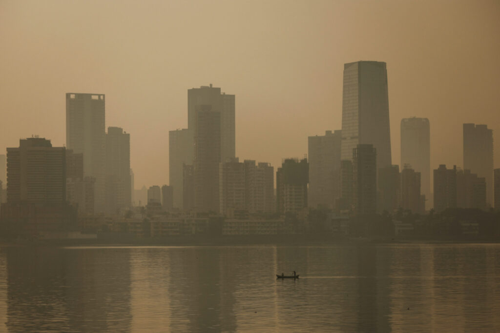 Men row a boat on a smoggy morning in Mumbai, India, on 13th November, 2023.