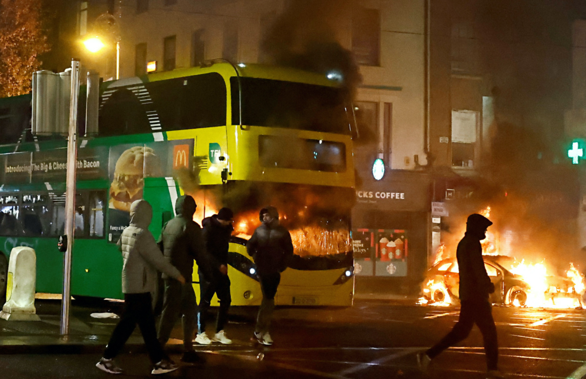 A bus burns during a demonstration following a suspected stabbing that left few children injured in Dublin, Ireland, on 23rd November, 2023.