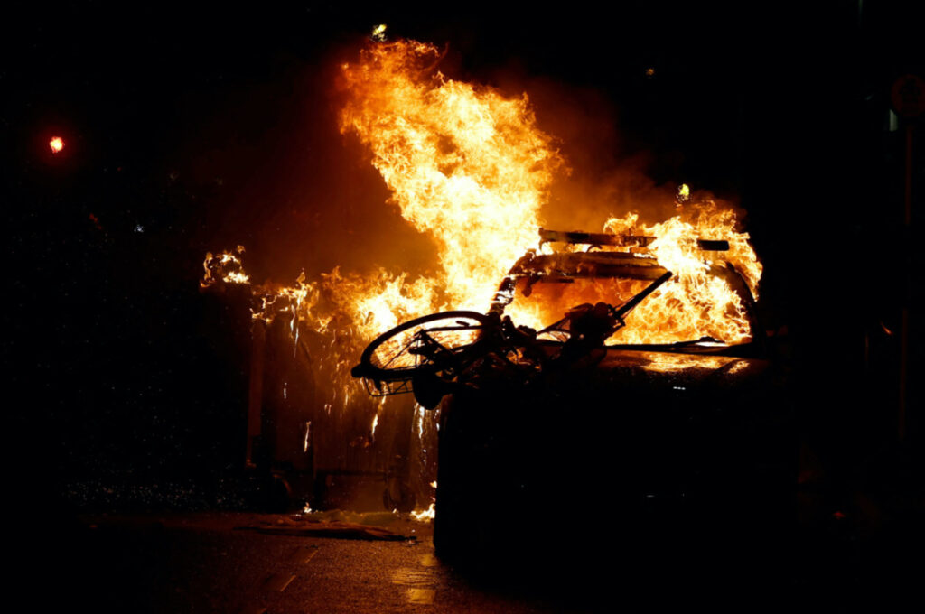 A police vehicle burns during a demonstration following a suspected stabbing that left few children injured in Dublin, Ireland, on 23rd November, 2023