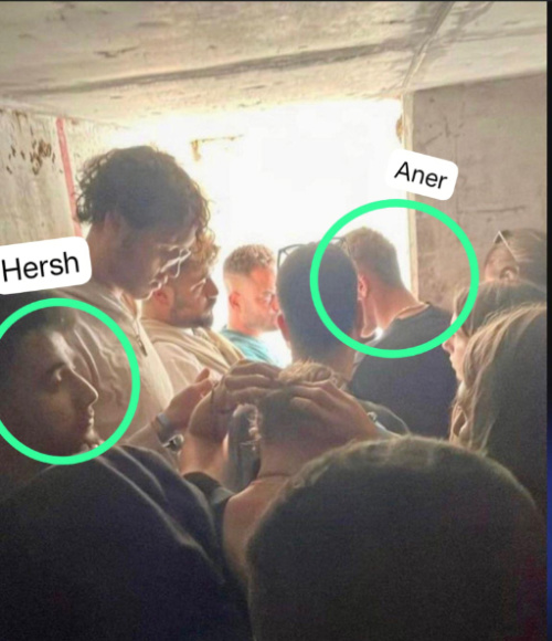 Hersh Goldberg-Polin, left, and Aner Shapiro, right, in a shelter with other festival attendees in southern Israel on 7th October, 2023
