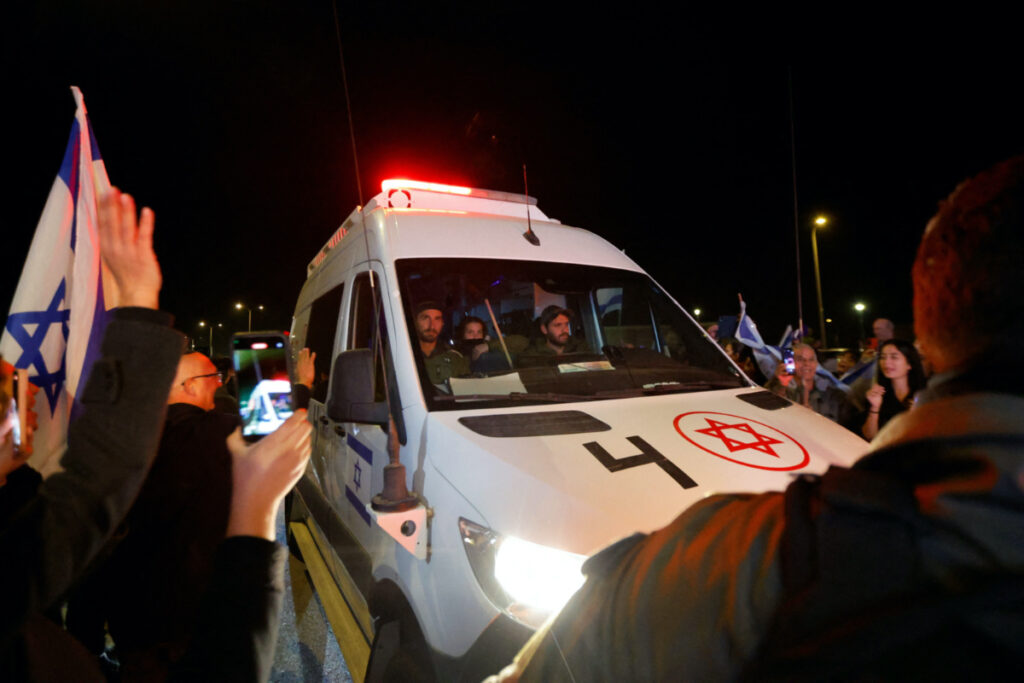 A vehicle carrying hostages released as part of a deal between Israel and Palestinian Islamist group Hamas, drives by, in Ofakim, Israel, on 30th November, 2023