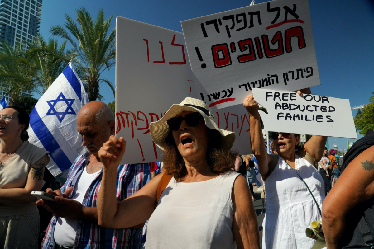 Israelis attend a demonstration, calling for the return of loved ones who were taken as hostages following a deadly infiltration by Hamas gunmen from the Gaza Strip, in Tel Aviv, Israel, October 14, 2023. REUTERS/Janis Laizans