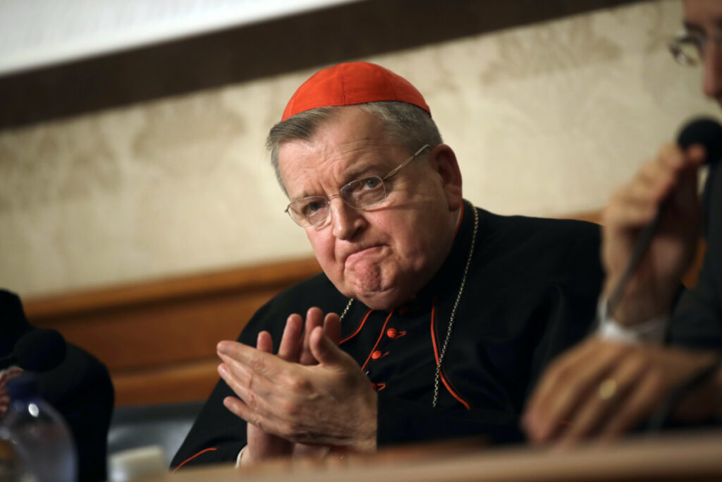Cardinal Raymond Burke applauds during a news conference at the Italian Senate, in Rome, on 6th September, 2018
