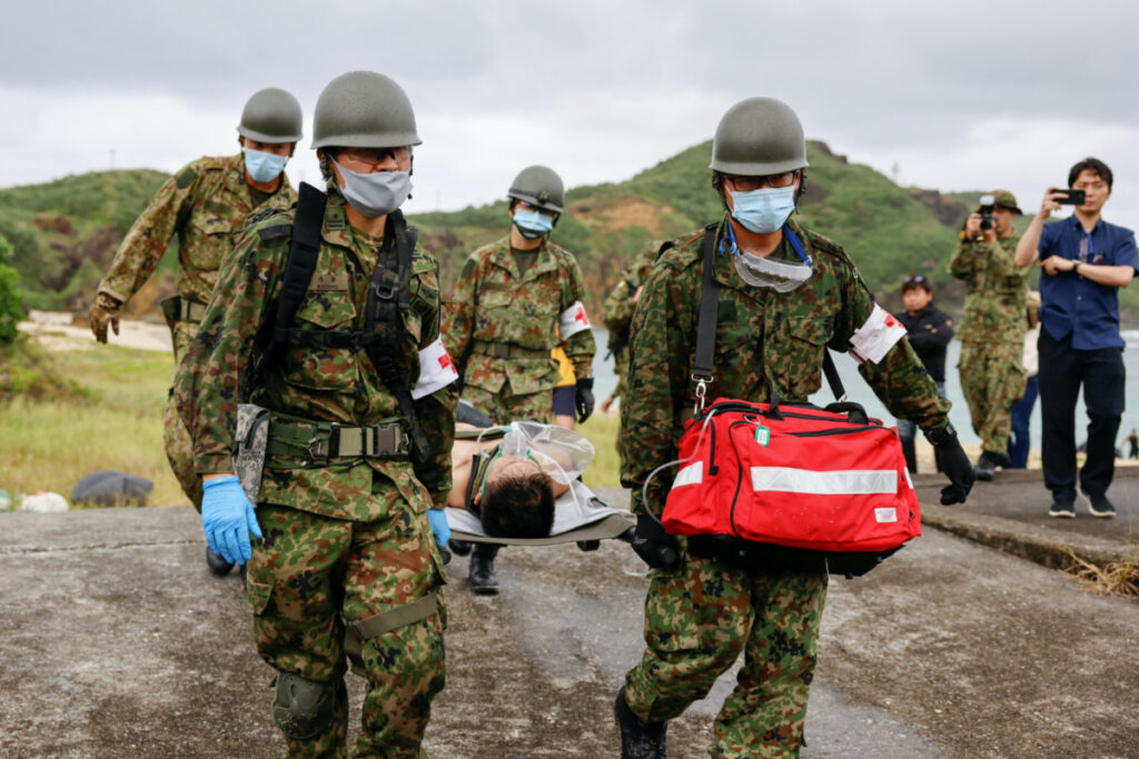 Japan Self-Defense Forces soldiers take part in an evacuation drill, on Nama Hama Beach at Yonaguni island, Japan's westernmost inhabited island in Okinawa prefecture, Japan, on 12th November, 2023.