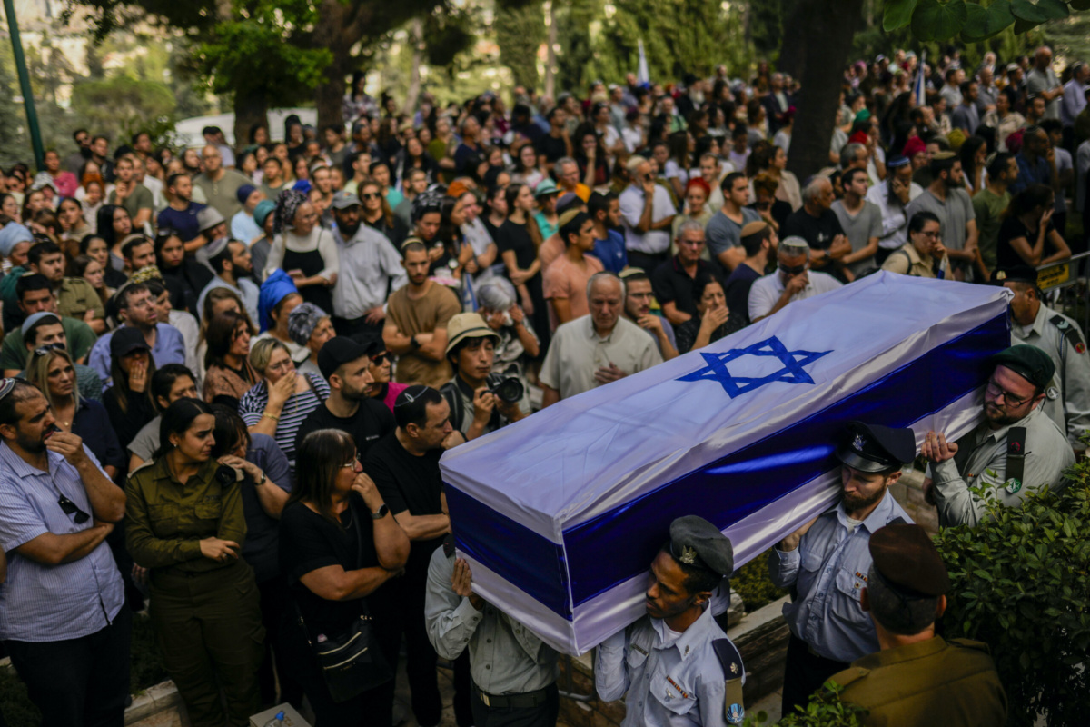 Israeli soldiers carry the flag-covered coffin of Shilo Rauchberger at the Mount Herzl cemetery in Jerusalem, on Thursday, 12th October, 2023