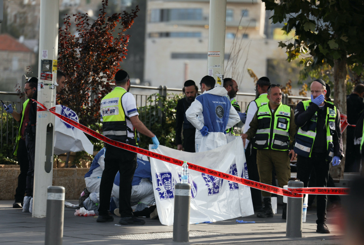 Israeli officials work at the scene of a violent incident in Jerusalem on 30th November, 2023 