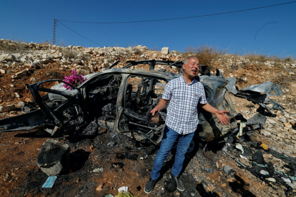 Samir Ayoub, uncle of three Lebanese girls killed along with their grandmother yesterday, by what he says was an Israeli airstrike that targeted their car in which they were traveling between Aytaroun and Aynata, speaks as he mourns them beside the burned car near the Lebanon and Israel border, in the outskirts of the southern town of Aynata, Lebanon on 6th November, 2023