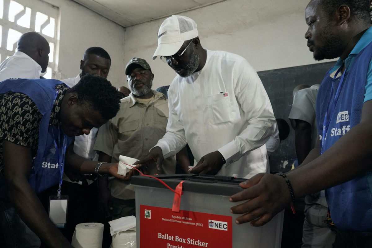Leader of Liberia's ruling party Coalition for Democratic Change, President and former soccer player George Weah, cleans his finger after casting his vote during the run-off election between him and former vice president Joseph Boakai in Monrovia, Liberia, on 14th November, 2023.