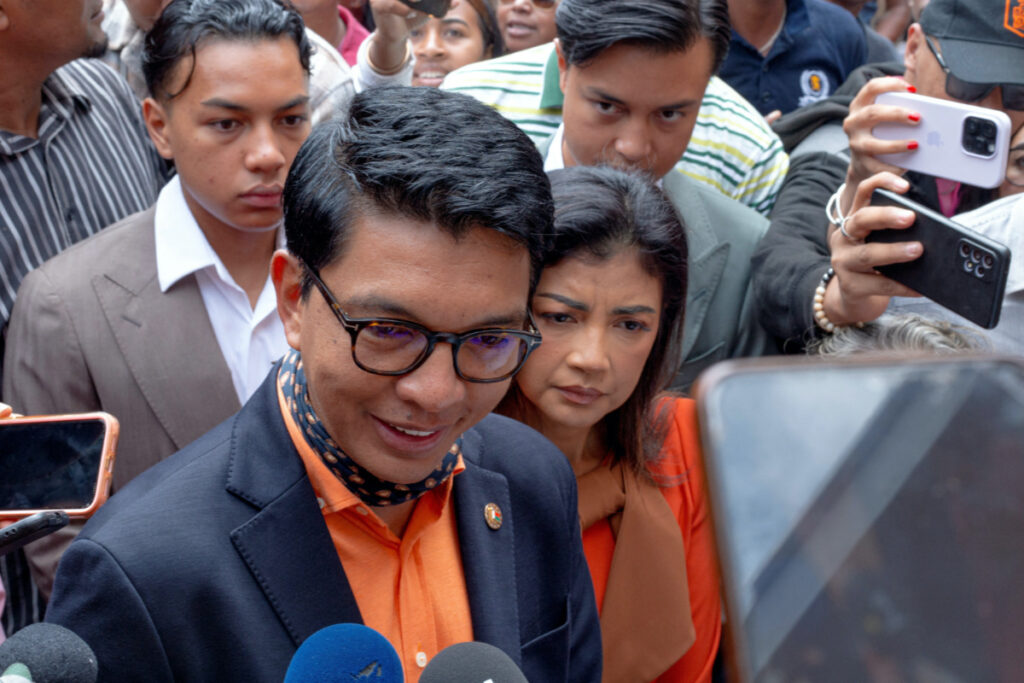 Madagascar's President and a presidential candidate Andry Rajoelina flanked by his wife Mialy Rajoelina as he arrives to cast his ballot at a polling station, during the presidential election in Ambatobe, Antananarivo, Madagascar, on 16th November, 2023.