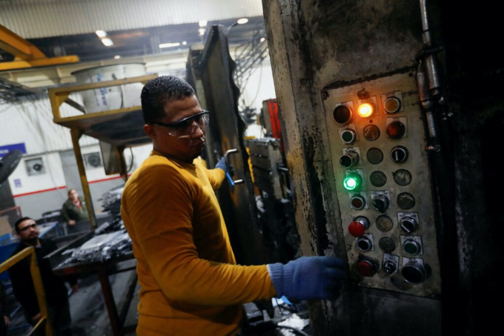 Walter Banegas, 28, originally from Honduras, works at the Pace Industries aluminum injection molding plant, his formal job after settling in Mexico as a refugee, in Saltillo, Mexico, on 16th October, 2023