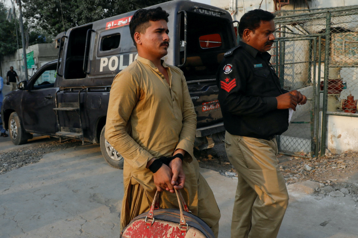 An Afghan national, who according to police was undocumented, is seen with his hands tied with a cloth-knot, as he was detained and shifted to a holding centre, after Pakistan gave the last warning to undocumented migrants to leave, in Karachi, Pakistan, on 1st November, 2023.