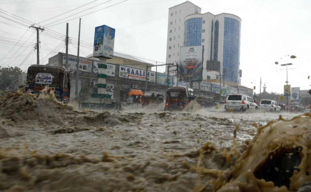 Motorists drive through a flooded street following heavy rains in Mogadishu, Somalia, on 8th November, 2023