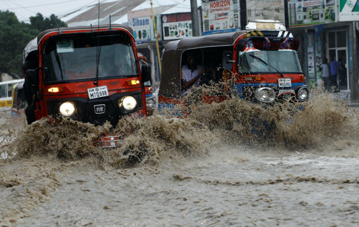 Rickshaw taxis drive through the flooded KM5 street following heavy rains in Mogadishu, Somalia, on 8th November, 2023