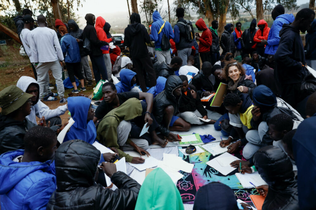 Several volunteers give Spanish classes to migrants outside the Las Raices Camp in La Laguna, Spain, on 5th November, 2023.