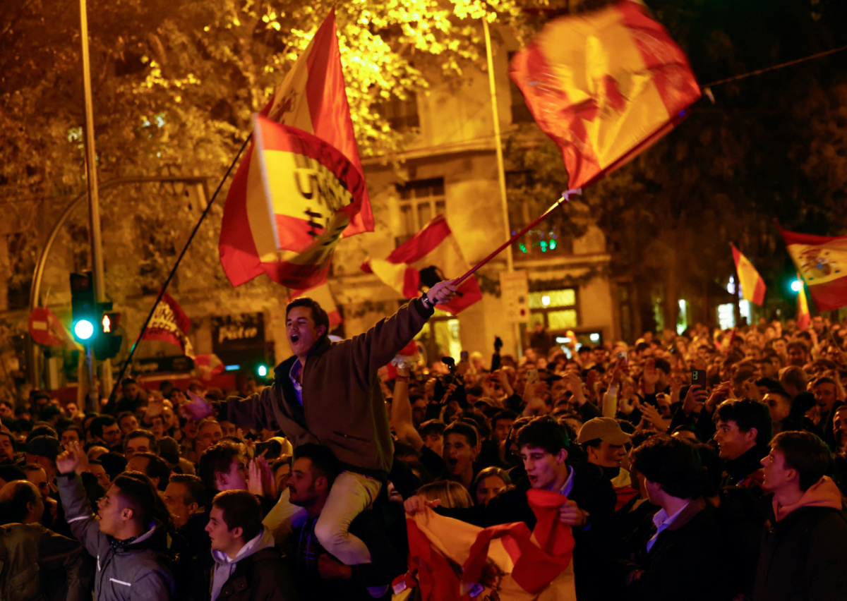 A demonstrator waves a flag during a protest near Spain's Socialists Party headquarters, following acting Prime Minister Pedro Sanchez's negotiations for granting an amnesty to people involved with Catalonia's failed 2017 independence bid, in Madrid, Spain, on 8th November, 2023