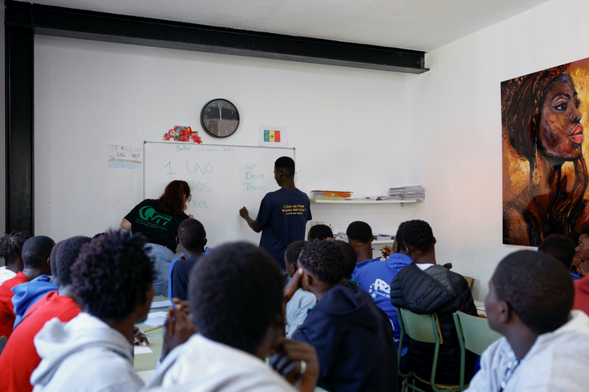Minor migrants attend Spanish classes with teacher Alejandra Rodriguez at the residence where they live in Valverde, Spain, on 7th November, 2023