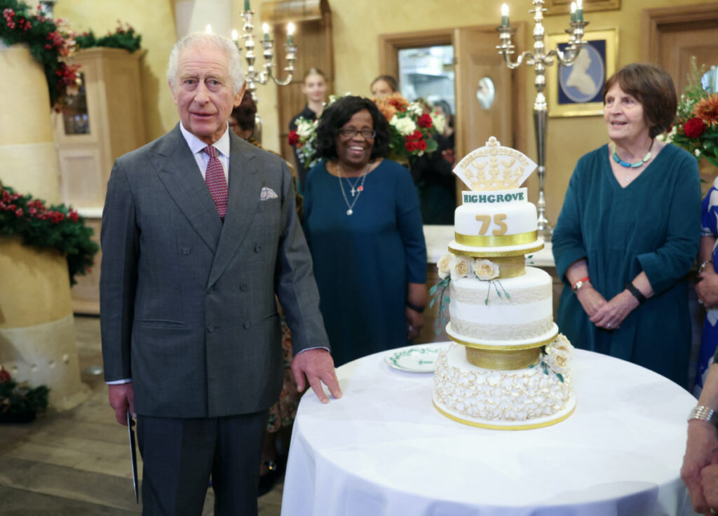 King Charles III poses with his cake as he attends his 75th birthday party hosted by the Prince's Foundation at Highgrove House on 13th November, 2023 in Tetbury, England.