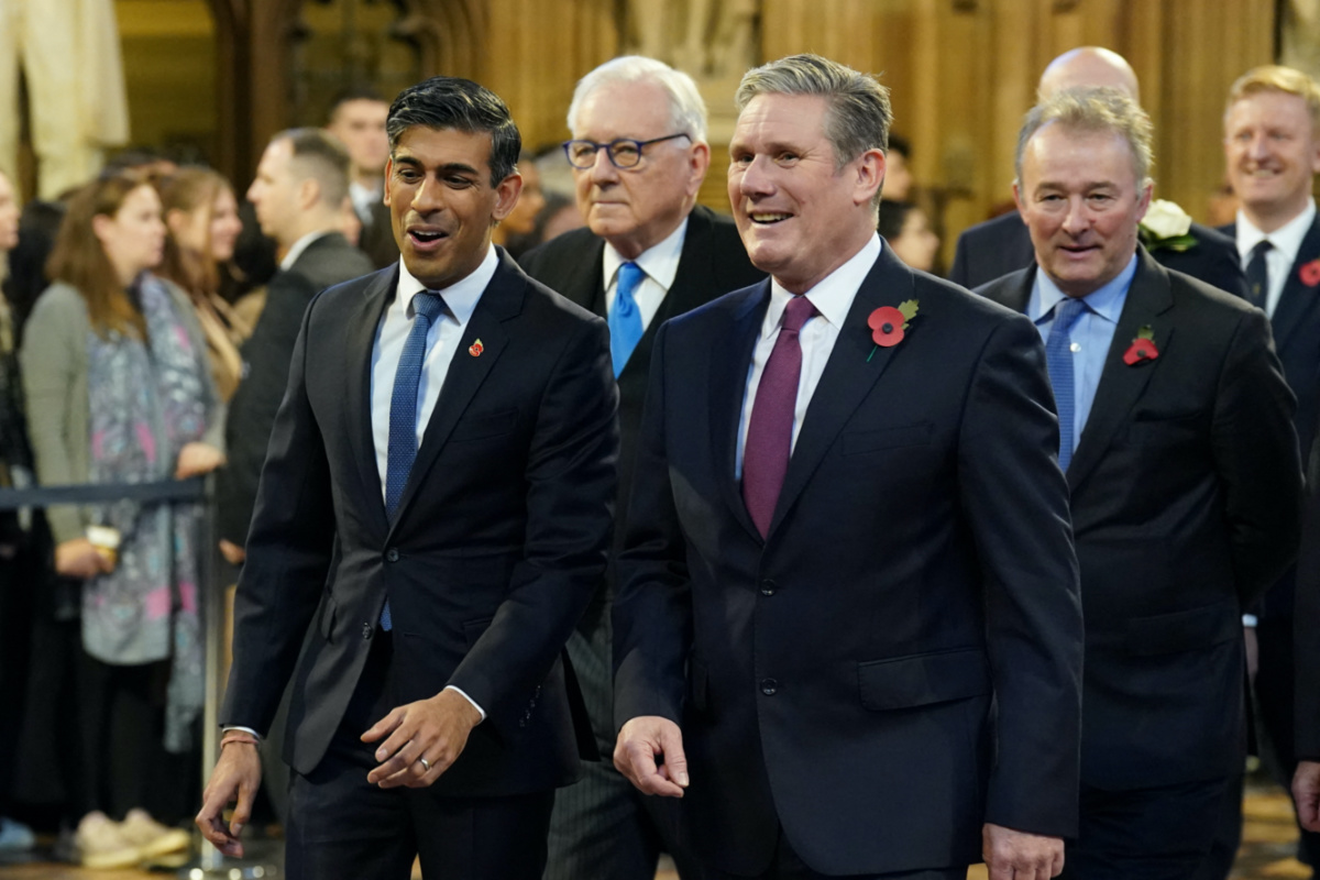 Britain's Prime Minister Rishi Sunak walks with Labour Party leader Sir Keir Starmer through the Central Lobby at the Palace of Westminster ahead of the State Opening of Parliament in the House of Lords, in London, Britain, on 7th November, 2023.