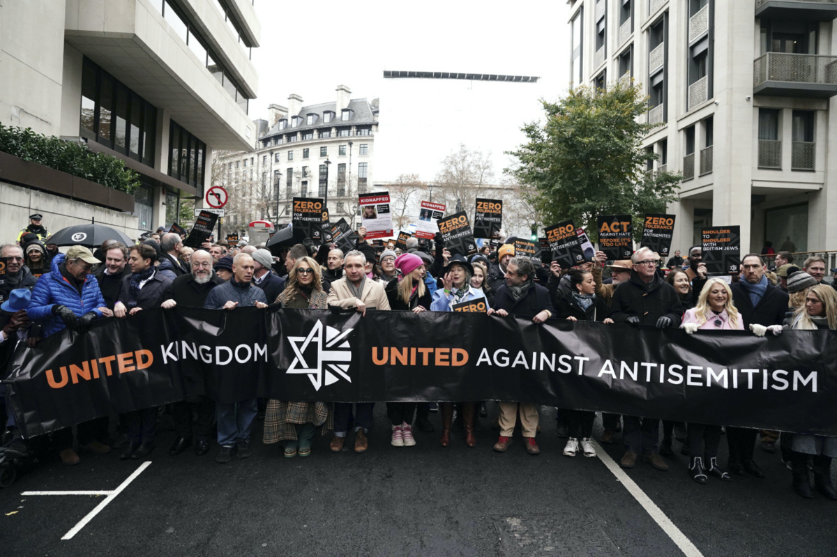 From fifth left to right, Chief Rabbi Mirvis, Robert Rinder, Tracey-Ann Oberman, Eddie Marsan, Rachel Riley, Maureen Lipman and Vanessa Feltz take part in a march against antisemitism organised by the volunteer-led charity Campaign Against Antisemitism at the Royal Courts of Justice in London, on Sunday, 26th November, 2023.