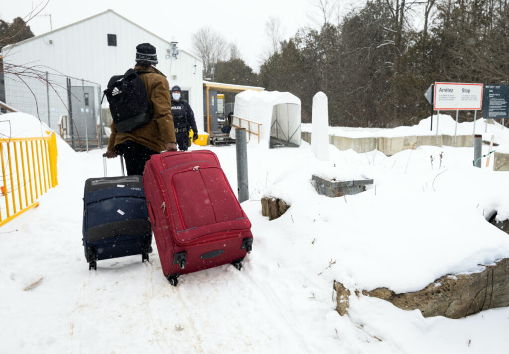 An asylum seeker arrives by taxi to cross into Canada from the US border on Roxham Road in Champlain, New York, US, on 25th February, 2023