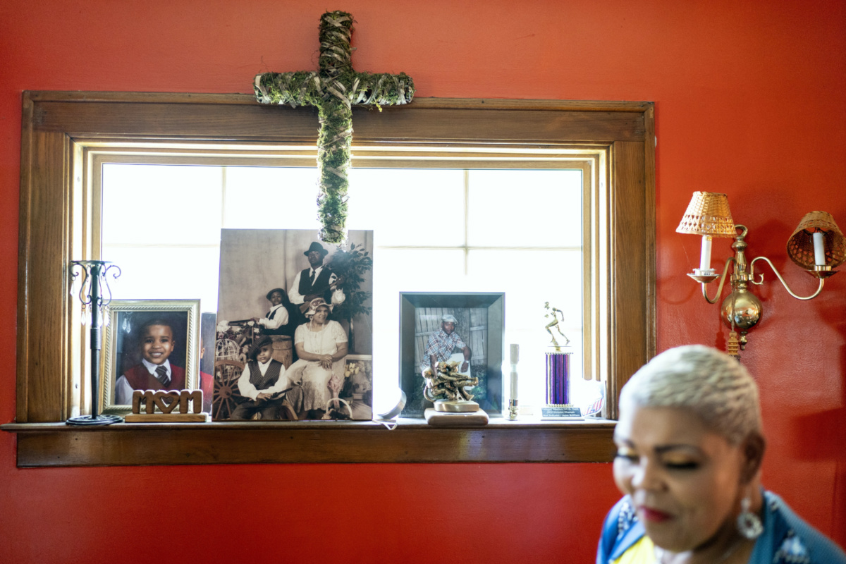 Family photos including a picture of her son, Jaylan, centre photo rear, decorate a window in Marsha McWilson's home, on Sunday, 20th August, 2023, in Niagara Falls, New York