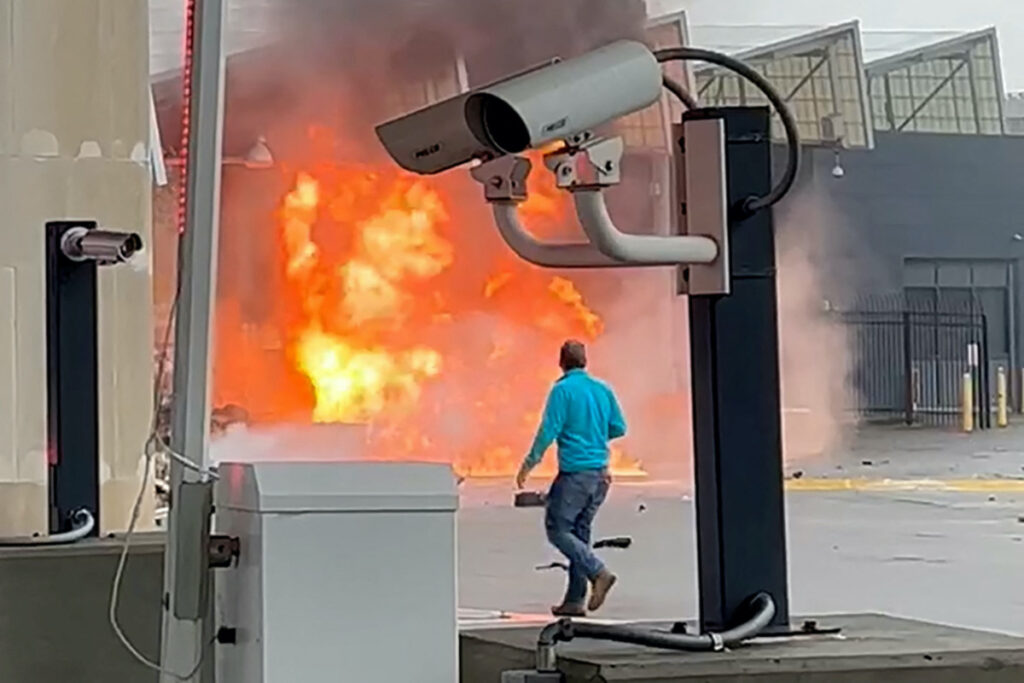 A vehicle burns at the Rainbow Bridge US border crossing with Canada, in Niagara Falls, New York, US, on 22nd November, 2023 in a still image from video. Courtesy Saleman Alwishah via REUTERS