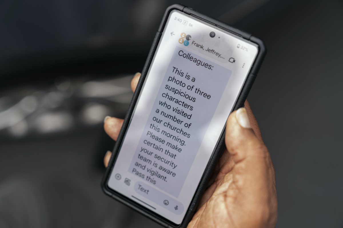 Rev Jimmie Hardaway, Jr, shows a text message he received from a fellow pastor alerting him to some suspicious people who attended an area church service, on Sunday, 20th August, 2023, in Buffalo, New York