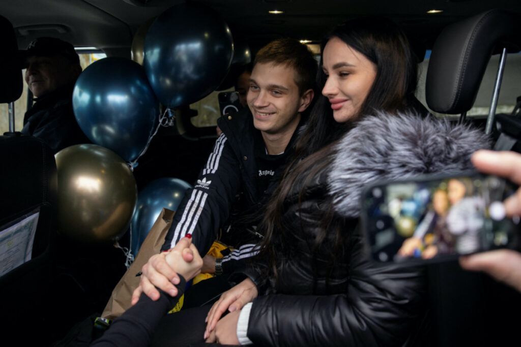 Bohdan Yermokhin, a Ukrainian teenager who was taken to Russia from the occupied city of Mariupol, shakes hands after arriving in Ukraine from Belarus at the border crossing in Kortelisy, amid Russia’s ongoing attack on Ukraine, on 19th November, 2023