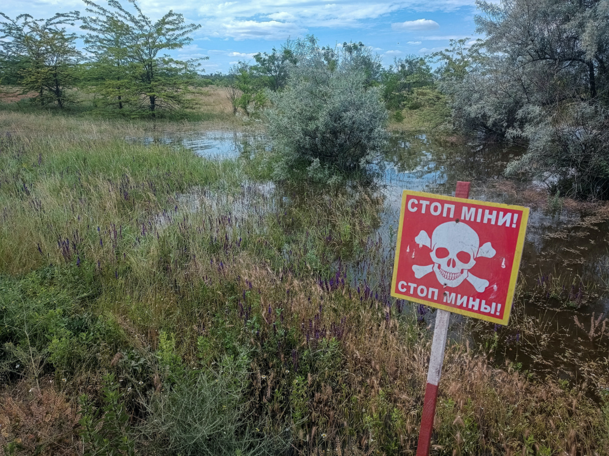 A mine danger sign is seen near a flooded area after the Nova Kakhovka dam breached, amid Russia's attack on Ukraine, in the village of Snihurivka in Kherson region, Ukraine, on 8th June, 2023.