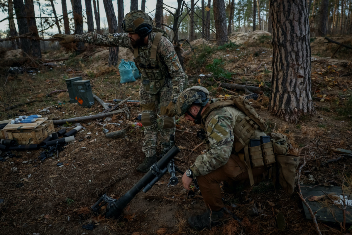 Servicemen of the 67th Mechanised Brigade of the Armed Forces of Ukraine prepare to fire a mortar at a position in a frontline near Kreminna, amid Russia's attack on Ukraine, in Luhansk region, Ukraine, on 2nd November, 2023